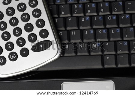 Business Tools - Silver Calculator On A Black Laptop Keyboard