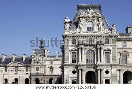 Large Typical Old French Building Facade On A Sunny Summer Day In Paris, France