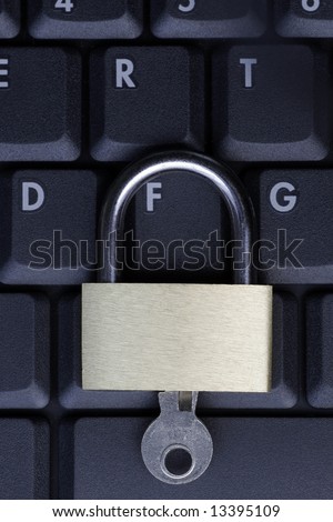 Closed Padlock On A Black Laptop Keyboard, IT Security Concept