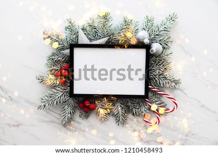 Christmas holiday frame background with xmas tree and xmas decorations. Merry Christmas greeting card, banner. Winter holiday theme. Happy New Year. Space for text