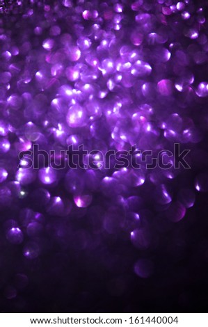 Unfocused abstract purple glitter holiday background