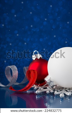 White, silver and red christmas ornaments on dark blue background. Merry christmas card. Winter holidays. Xmas theme.