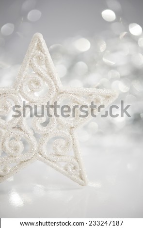 White christmas star on bokeh lights background with space for text. Merry christmas card. Winter holidays. Xmas theme.