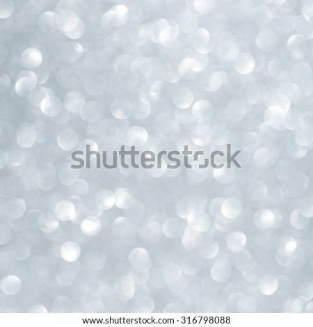 Unfocused abstract light blue glitter holiday background. Winter xmas holidays.