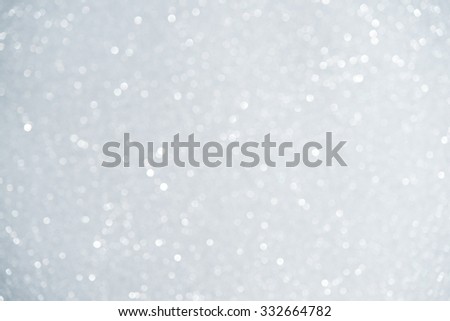 Unfocused abstract white glitter holiday background. Winter xmas holidays. Christmas.