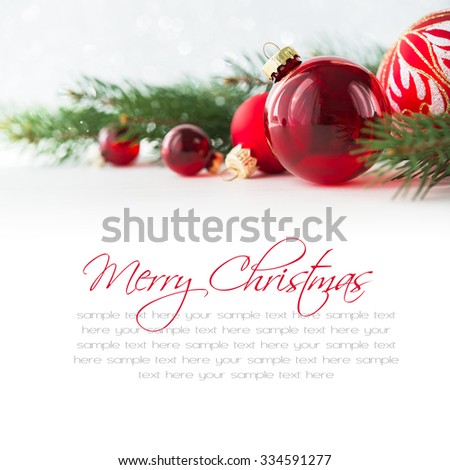 Red xmas ornaments and xmas tree on white background. Merry christmas card. Winter holidays. Xmas theme. Happy New Year. Space for text.
