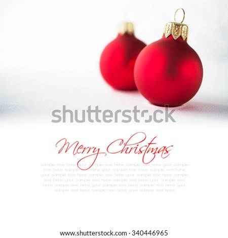 Red christmas ornaments on glitter holiday background. Winter holidays. Xmas theme. Space for text. Happy New Year.