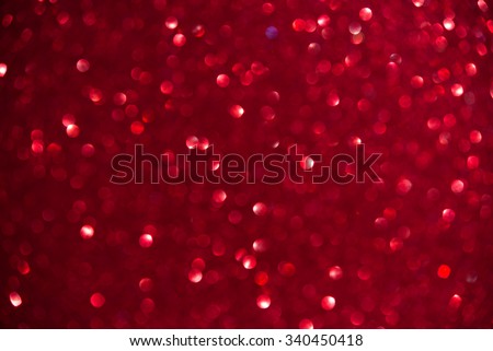 Unfocused abstract red glitter holiday background. Winter xmas holidays. Christmas. Valentine\'s day.