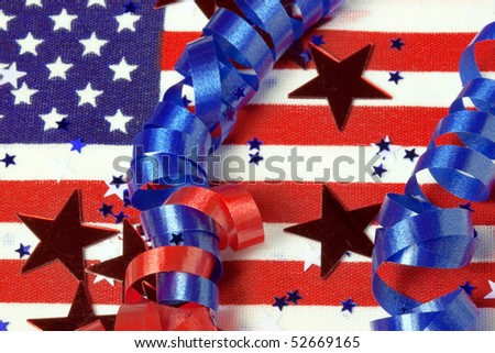 american flag with patriotic confetti and ribbon curls