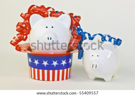 Two patriotic piggy banks, one sitting in a stars and stripes hat, with red and blue ribbon curls on a white background.
