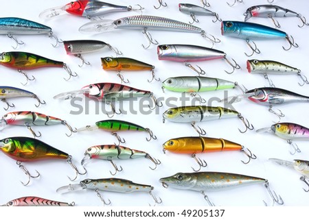 metal angling baits on white background. Fishing tackles