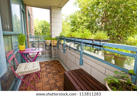 Balcony Of Condo With Patio Furniture And Plants Stock ...