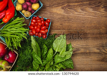 Fresh farmers market fruit and vegetable from above with copy space on brown wood