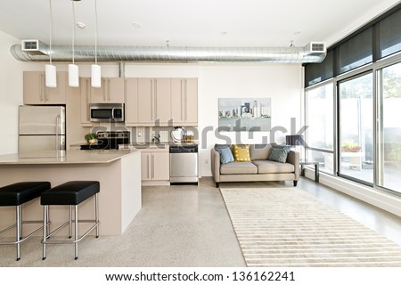 Kitchen And Living Room Of Loft Apartment
