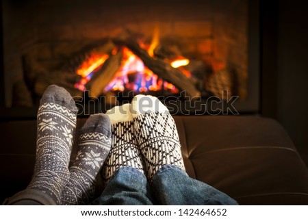 Feet In Wool Socks Warming By Cozy Fire