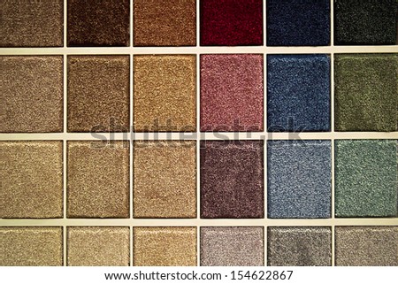 Samples of carpet patches in various colors