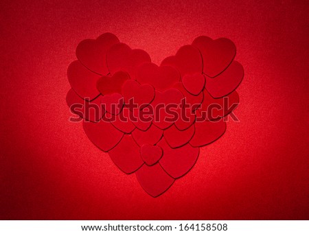 Romantic heart made of many smaller red paper hearts for valentines day