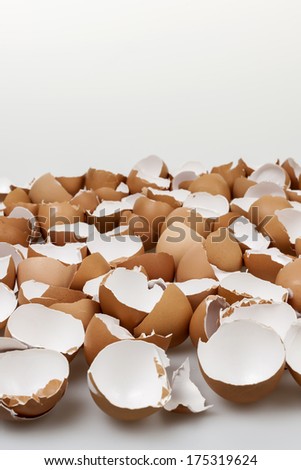 Pile of many broken brown empty eggshells