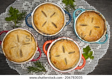 Four individual size meat pot pies from above