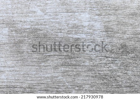 Old wooden background of weathered distressed rustic wood with faded light blue paint showing woodgrain texture