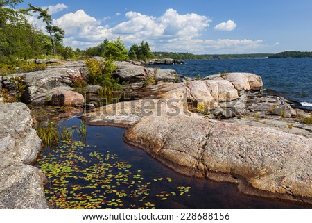 Rock formations at rocky lake shore of Georgian Bay near Parry Sound, Ontario Canada