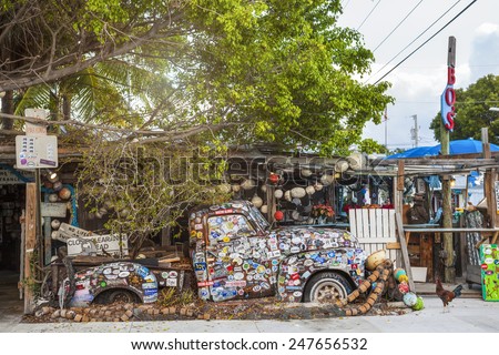 KEY WEST, FL - DECEMBER 29: Old truck covered with bumper stickers at Bo\'s Fish Wagon restaurant in Key West, Florida in 2014