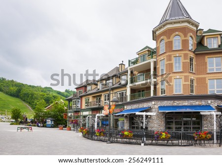 COLLINGWOOD, ON, CANADA - JUNE 18: Copper Blues restaurant patio and shops near summer ski hill at Blue Mountain Village, 2014