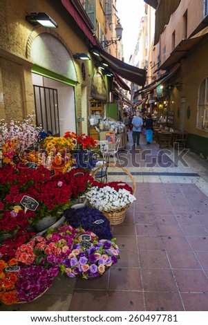 NICE, FRANCE - OCTOBER 2, 2014: Walking pedestrian Rue Pairoliere, a quaint shopping street lined with food shops and cafes, is a great way to experience authentic Nice.