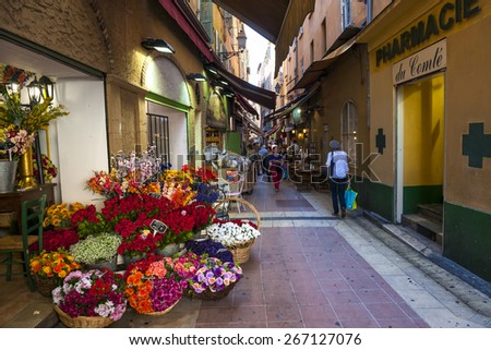 NICE, FRANCE - OCTOBER 2, 2014: Walking pedestrian Rue Pairoliere, a quaint shopping street lined with food shops and cafes, is a great way to experience authentic Nice.