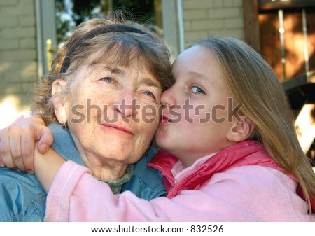 Granddaughter kissing and hugging her grandmother