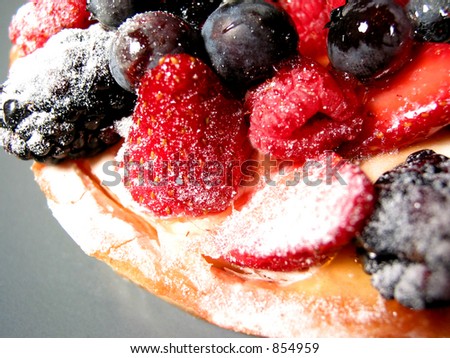 Closeup on mixed berry tart on a plate