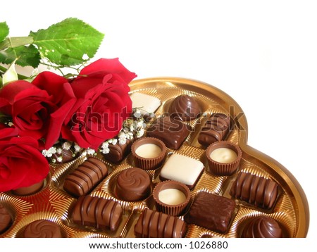 Heart shaped box of chocolates with red roses isolated on white background