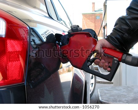 Car being filled up with gas at gas pump