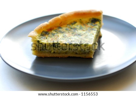 Slice of quiche on plate