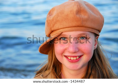 stock photo Cute preteen girl smiling wearing suede hat cute preteen