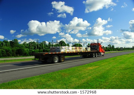 Speeding truck on highway, blurred because of motion