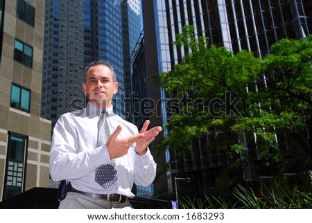 Businessman explaining an idea downtown