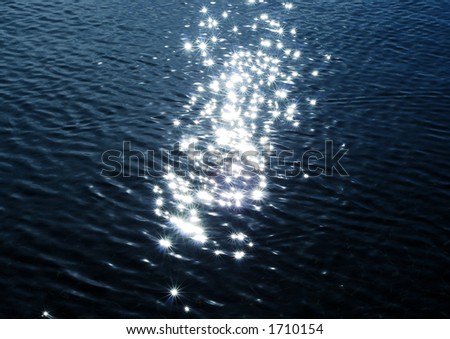 Magic sparkles on water from low sun, star effect