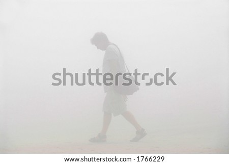 Man trying to find his way in a thick fog