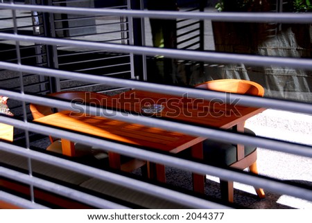 Outdoor patio of a restaurant behind blinds