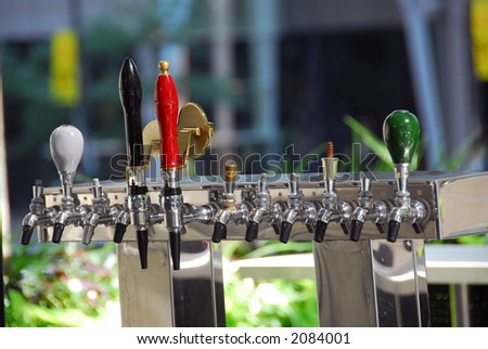 Cold sweating beer tap in outdoor bar