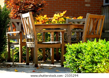 House patio with natural wooden patio furniture