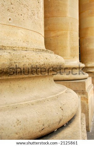 Closeup of row of stone columns in perspective