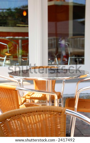 Summer patio of outdoor cafe with furniture