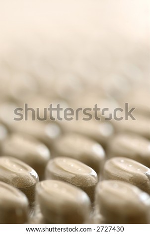 Background of herbal supplement pills close up