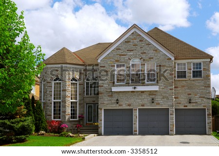 Big luxury residential house with natural stone facing
