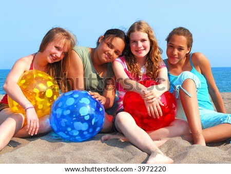 stock photo Portrait of four young girls with colorful beach balls stock photo Portrait of four young girls with colorful beach balls