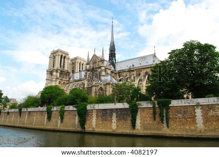 Cathedral of Notre Dame de Paris - side view with rose window. Paris, France.