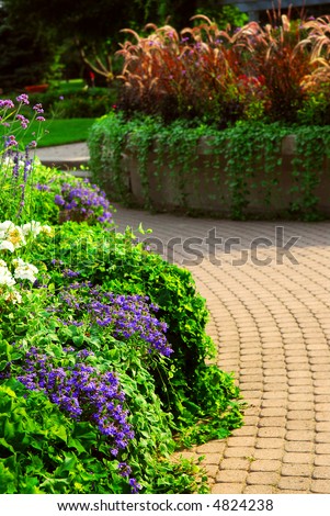 Formal garden with blooming flowers in the summer