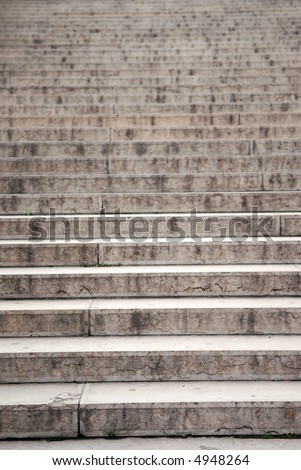 Long concrete stairway, focus on the bottom steps